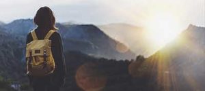 Hiker looking sunlight in trip in Spain country