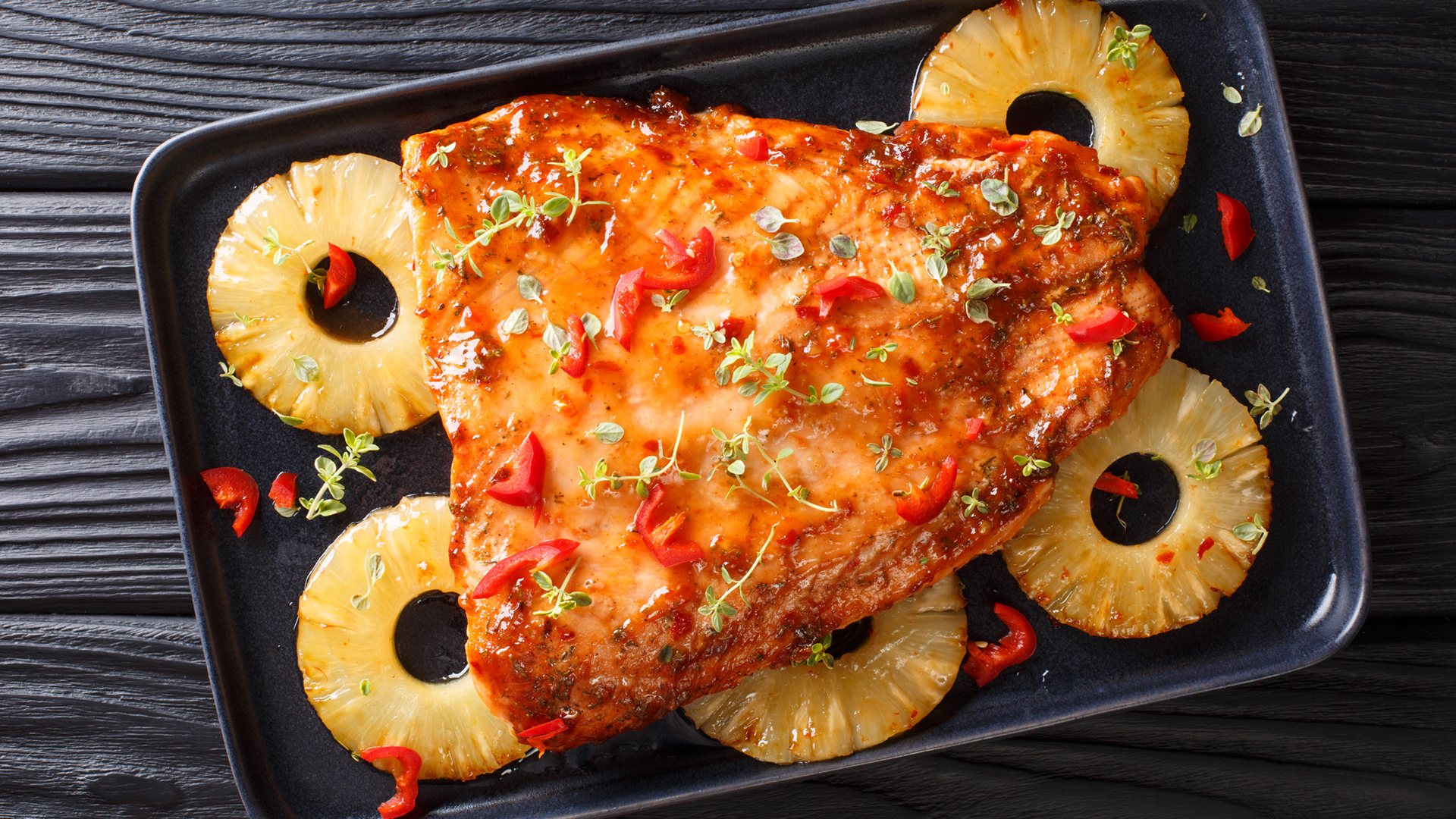Baked pineapple salmon in a baking tray