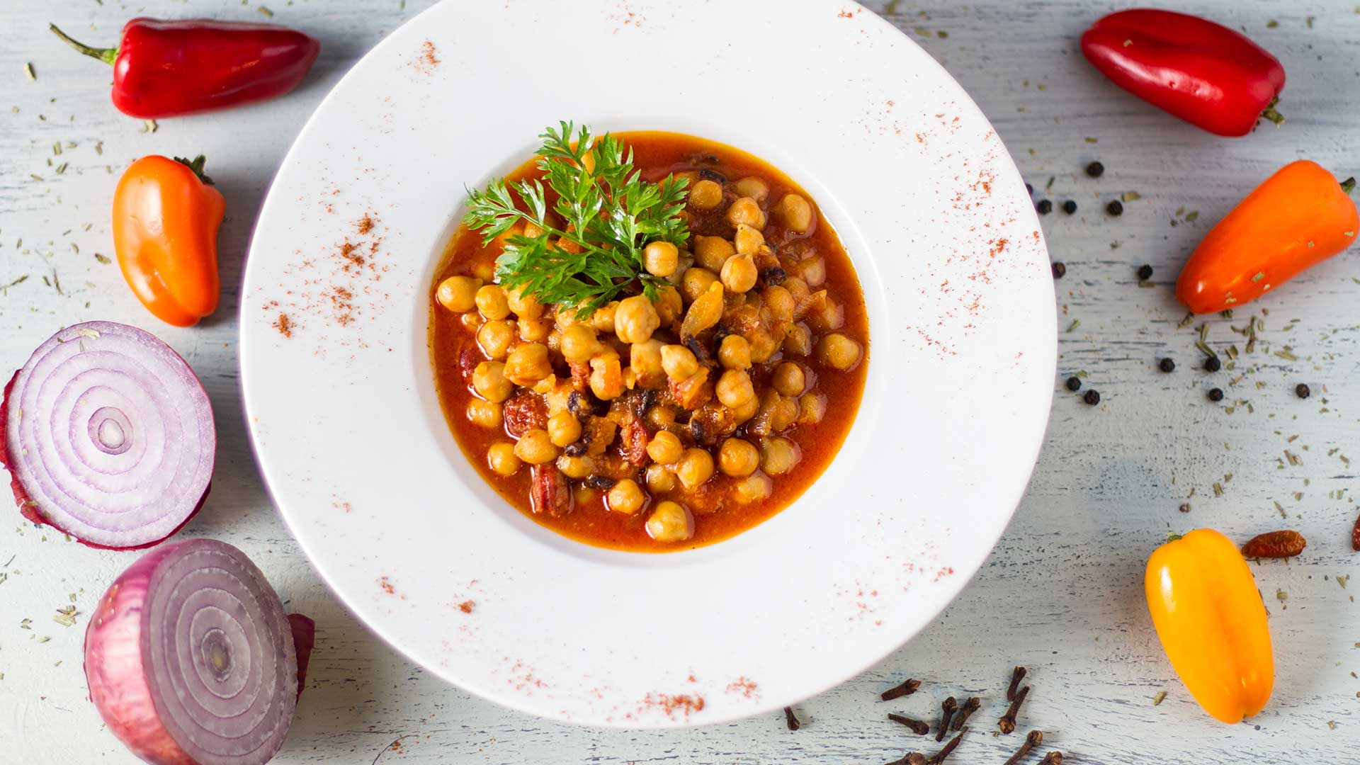 chickpeas in tomato sauce with fresh herbs