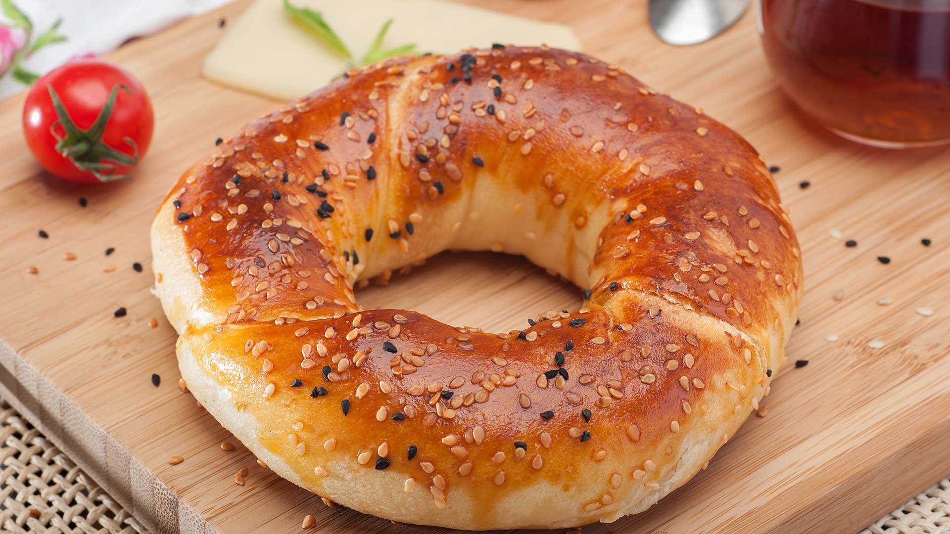 Close up of traditional Turkish bagel acma with cheese and tomatoes