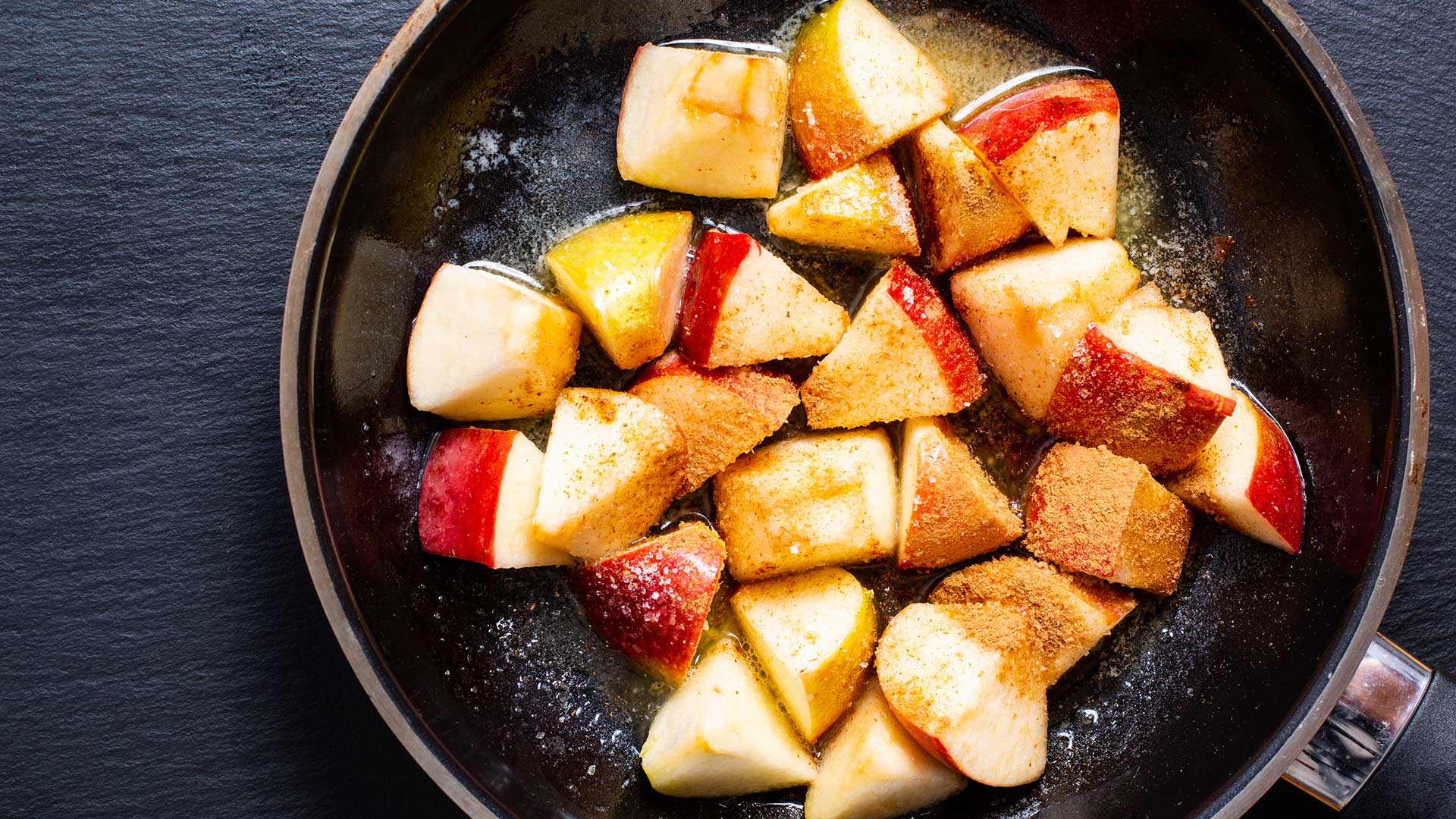 apple fries on pan cinnamon on top