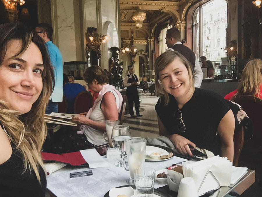 Guests eating breakfast in historic dining room of New York Cafe, Budapest