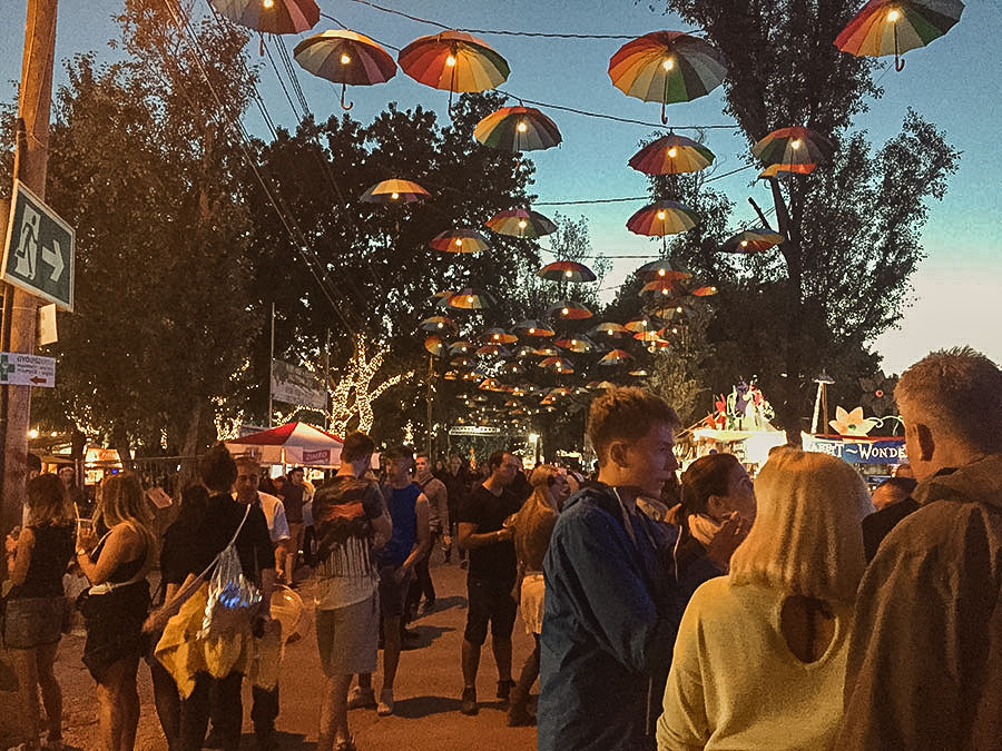 Festivalgoers enjoying Sziget Festival at dusk