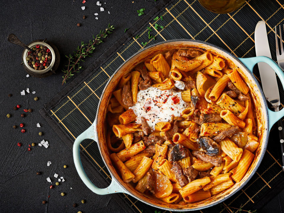 beef stroganoff on black countertop