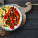 beef goulash with mash on plate on black table