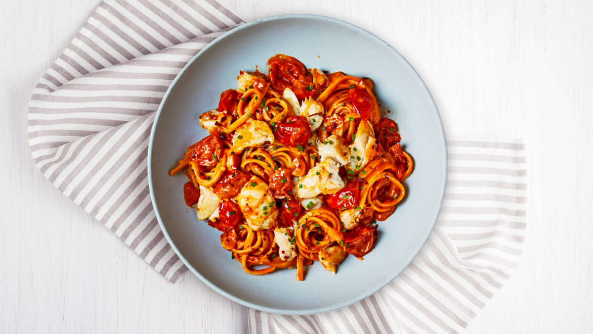 creamy haddock linguine on pale blue plate