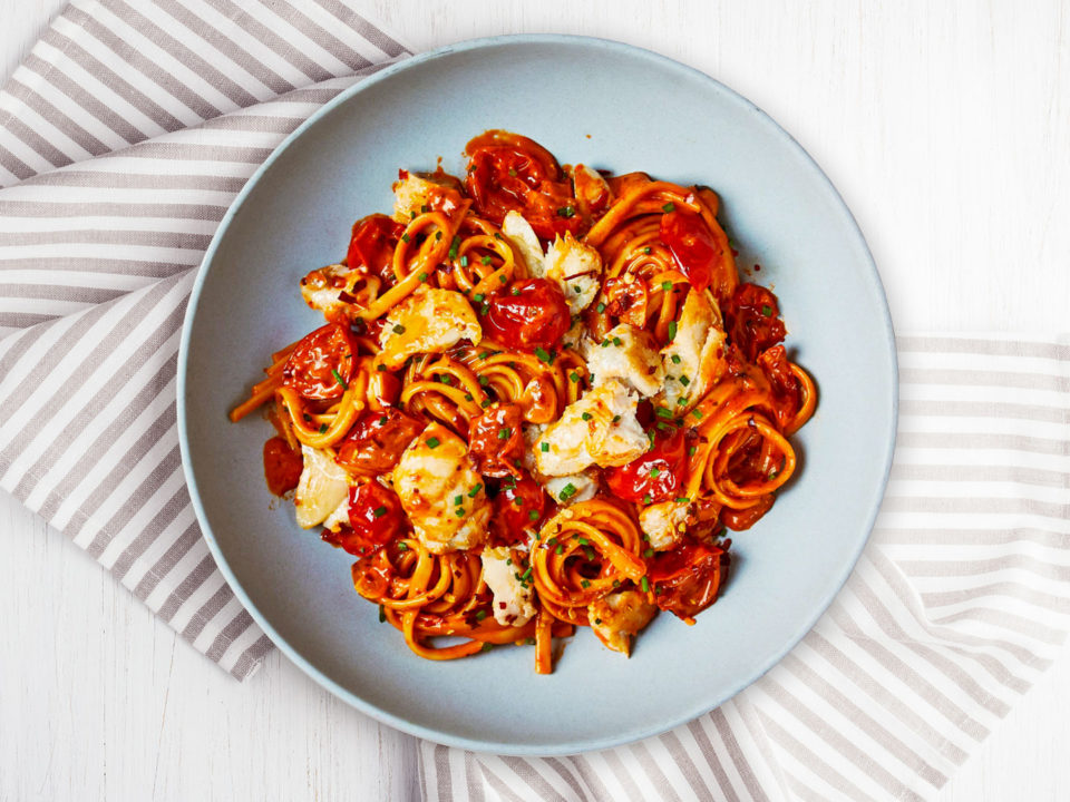 creamy haddock linguine on pale blue plate