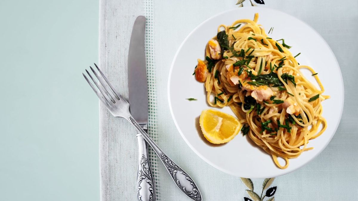 Lemony smoked fish and spinach linguine on plate