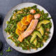 salmon salad with orange on black table top