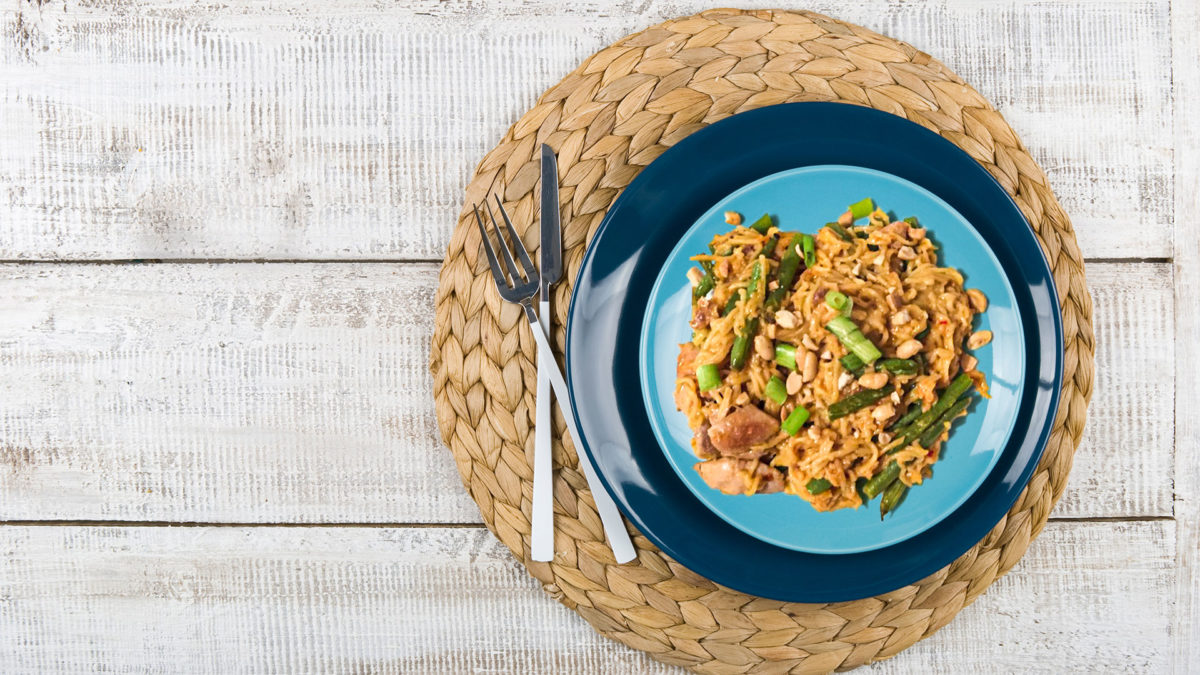 Spicy Peanut Chicken Noodles on blue plate